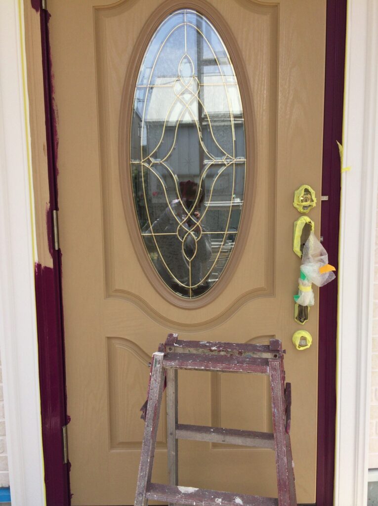 熊取町 玄関ドア 塗装工事の施工前写真